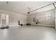 A two-car garage with an epoxy floor, windows and an electric garage door opener at 859 Academy St, Charlotte, NC 28205