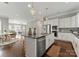 Spacious kitchen with granite countertops, stainless appliances, and open layout to the dining and living areas at 859 Academy St, Charlotte, NC 28205