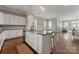 Large kitchen with granite counters, stainless appliances, and open to dining and living areas at 859 Academy St, Charlotte, NC 28205