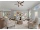 Spacious living room featuring a plush sofa, stylish armchairs, and lots of natural light, ideal for relaxing and entertaining at 859 Academy St, Charlotte, NC 28205