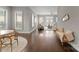 Bright, open-concept living space features hardwood floors and large windows with plantation shutters at 859 Academy St, Charlotte, NC 28205