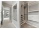 A walk-in closet with custom shelving and drawers provides ample storage space at 859 Academy St, Charlotte, NC 28205
