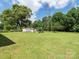 Large backyard with storage shed and mature trees at 876 Stowe Ln, Gastonia, NC 28056