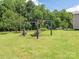 Spacious backyard with a metal gazebo and an old brick grill at 876 Stowe Ln, Gastonia, NC 28056