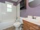 Bathroom with a vanity, toilet, and shower/tub combination at 876 Stowe Ln, Gastonia, NC 28056