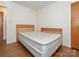 Bedroom featuring hardwood floors, and white painted walls and trim, two wood bed frames at 876 Stowe Ln, Gastonia, NC 28056