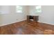 Bedroom with hardwood floors and lots of natural light from two windows at 876 Stowe Ln, Gastonia, NC 28056