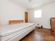Cozy bedroom featuring hardwood floors and a comfortable-sized bed with natural light at 876 Stowe Ln, Gastonia, NC 28056