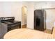 Classic kitchen featuring black appliances, a round table, ample cabinet space, and a light color scheme at 876 Stowe Ln, Gastonia, NC 28056