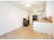 Open-concept kitchen with white cabinetry, black appliances, a breakfast bar and natural light creating the perfect space at 876 Stowe Ln, Gastonia, NC 28056