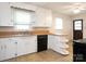 Galley kitchen with window view and black dishwasher at 876 Stowe Ln, Gastonia, NC 28056