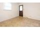 Neutral room with door to exterior and vinyl floor at 876 Stowe Ln, Gastonia, NC 28056