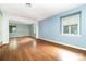 Sunlit living room featuring hardwood floors and a spacious layout at 9139 Robert Frost Ln, Charlotte, NC 28213