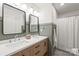 Beautiful bathroom featuring double vanity, wood cabinets, and modern fixtures at 936 Knightsbridge Rd, Fort Mill, SC 29708
