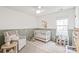 Adorable Bedroom with white crib, neutral rocking chair, and accent decorations at 936 Knightsbridge Rd, Fort Mill, SC 29708