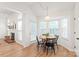 Cozy dining area filled with natural light from large windows, adjacent to the fireplace at 936 Knightsbridge Rd, Fort Mill, SC 29708