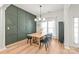Elegant dining room featuring hardwood floors, wainscoting, and a modern chandelier at 936 Knightsbridge Rd, Fort Mill, SC 29708