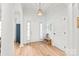 Bright foyer featuring wood floors, neutral walls, and a charming pendant light at 936 Knightsbridge Rd, Fort Mill, SC 29708