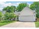 Beautifully landscaped home with a two-car garage and mature trees at 936 Knightsbridge Rd, Fort Mill, SC 29708