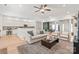 Open-concept living room with hardwood floors seamlessly connects to the kitchen and dining areas at 936 Knightsbridge Rd, Fort Mill, SC 29708