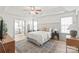Spacious main bedroom features a tray ceiling, ceiling fan, and ensuite bath access at 936 Knightsbridge Rd, Fort Mill, SC 29708