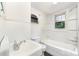 Classic bathroom design features white tile, a vintage sink, and a bathtub with shower for practical use at 952 8Th Ne St, Hickory, NC 28601