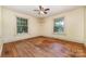 A serene bedroom with hardwood floors and two windows, offers natural light and a peaceful atmosphere at 952 8Th Ne St, Hickory, NC 28601