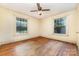 An inviting bedroom with hardwood floors and dual windows, perfect for relaxation and rest at 952 8Th Ne St, Hickory, NC 28601