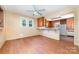 Bright dining area featuring hardwood floors and a cozy eat-in bar connecting to adjacent room at 952 8Th Ne St, Hickory, NC 28601
