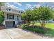 Charming home showcasing well-manicured lawn and driveway, with mature trees accentuating the home's curb appeal at 952 8Th Ne St, Hickory, NC 28601