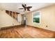 Inviting living room featuring hardwood floors, abundant natural light, and classic staircase design at 952 8Th Ne St, Hickory, NC 28601