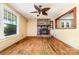 Inviting living room featuring hardwood floors, fireplace, abundant natural light, and ceiling fan at 952 8Th Ne St, Hickory, NC 28601