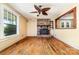 Inviting living room featuring hardwood floors, fireplace, abundant natural light, and ceiling fan at 952 8Th Ne St, Hickory, NC 28601