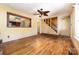 Sunlit living area with hardwood floors, connecting to a kitchen view and staircase, ideal for modern living at 952 8Th Ne St, Hickory, NC 28601