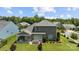 Aerial view of a backyard with a covered patio, dining area, and well-maintained lawn at 1036 Squire Dr, Fort Mill, SC 29707