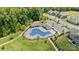 Aerial view of community pool and recreational area including playground, parking, and seating at 1036 Squire Dr, Fort Mill, SC 29707