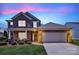 Charming two-story brick home with well-manicured lawn and attached two-car garage at 1036 Squire Dr, Fort Mill, SC 29707