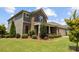 Exterior view of a brick and siding home with well-manicured landscaping at 1036 Squire Dr, Fort Mill, SC 29707