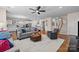 Spacious living area with a staircase and modern decor, open to the kitchen at 1036 Squire Dr, Fort Mill, SC 29707