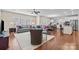 Open-concept living room and kitchen, featuring hardwood floors and modern furniture at 1036 Squire Dr, Fort Mill, SC 29707