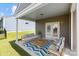 Covered patio featuring a seating area with a sofa, chairs, and an outdoor rug at 1036 Squire Dr, Fort Mill, SC 29707