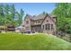 Spacious backyard features a lush lawn, patio area, and manicured landscaping, providing a perfect outdoor retreat at 1056 James Madison Dr, Matthews, NC 28104