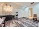 Finished basement including a wet bar, vinyl floors, and bright lighting at 1056 James Madison Dr, Matthews, NC 28104