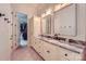 Bathroom featuring a marble countertop, tile flooring and custom cabinetry at 1056 James Madison Dr, Matthews, NC 28104