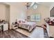 Cozy bedroom featuring high ceilings, wood floors, a circular window, and a bright area rug at 1056 James Madison Dr, Matthews, NC 28104