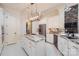 Beautiful kitchen with island featuring marble countertops, stainless steel appliances, and custom cabinetry at 1056 James Madison Dr, Matthews, NC 28104