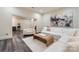 Bright living room with modern furniture, an abstract painting and vinyl floors at 1056 James Madison Dr, Matthews, NC 28104