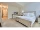 Bright bedroom with neutral carpet, crisp white walls, and light-colored furniture at 1056 James Madison Dr, Matthews, NC 28104