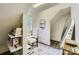 Cozy office space with custom book shelves, bright lighting, and a comfortable chair at 1056 James Madison Dr, Matthews, NC 28104