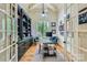 Bright office with hardwood floors, custom built-ins, and a large window at 1056 James Madison Dr, Matthews, NC 28104